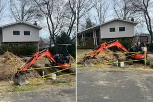 Excavator in use for sewer line replacement at a residential property in Richmond, VA, showcasing the trenching and installation process.